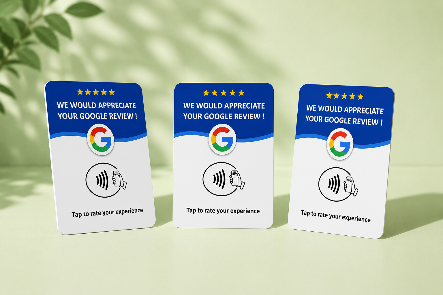 Three Revvo Tap Cards standing on a light green surface